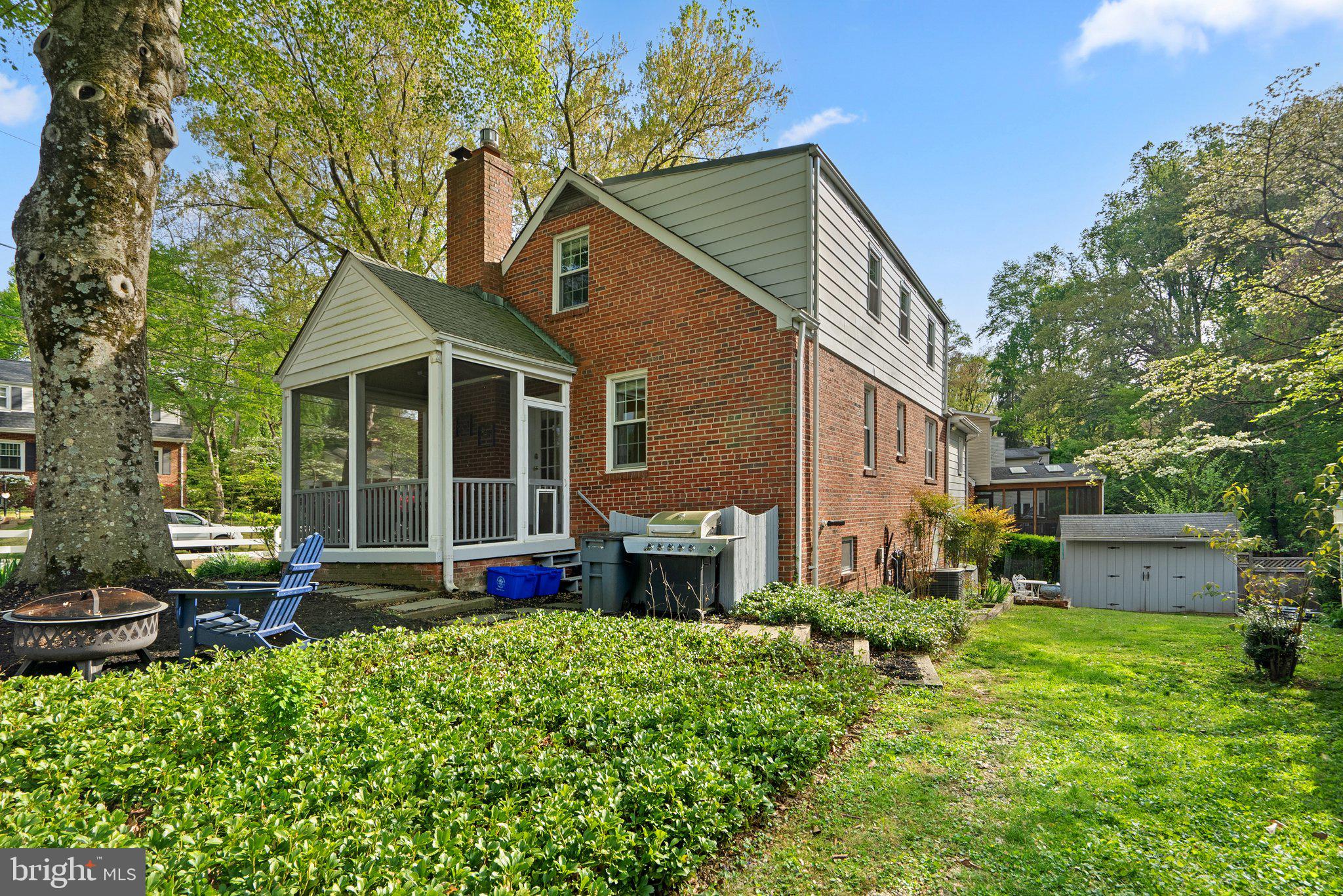 10406 Brookmoor Drive Silver Spring, MD 20901 - Photo 40 of 45 a front view of a house with a yard table and chairs
