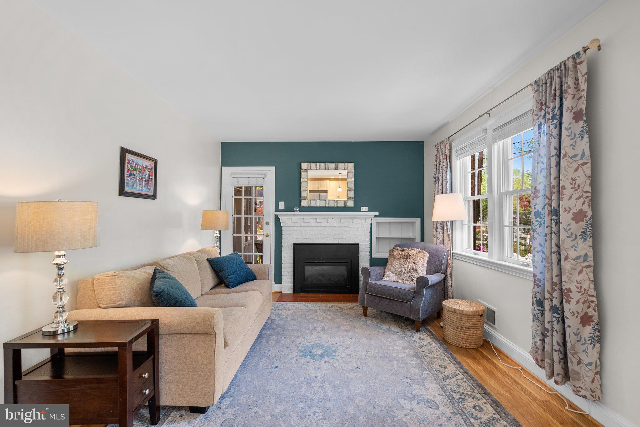 10406 Brookmoor Drive Silver Spring, MD 20901 - Photo 5 of 45 a living room with furniture and a fireplace