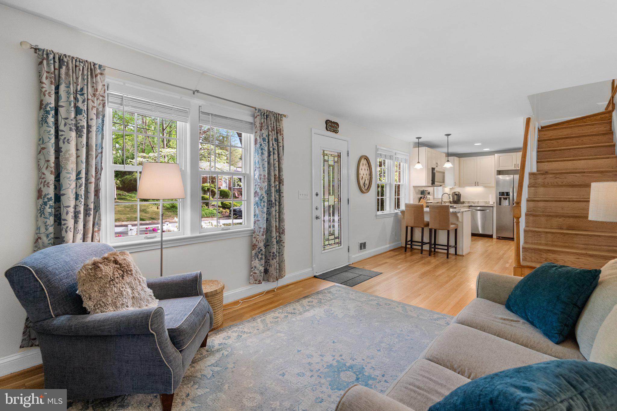10406 Brookmoor Drive Silver Spring, MD 20901 - Photo 7 of 45 a living room with furniture and a large window