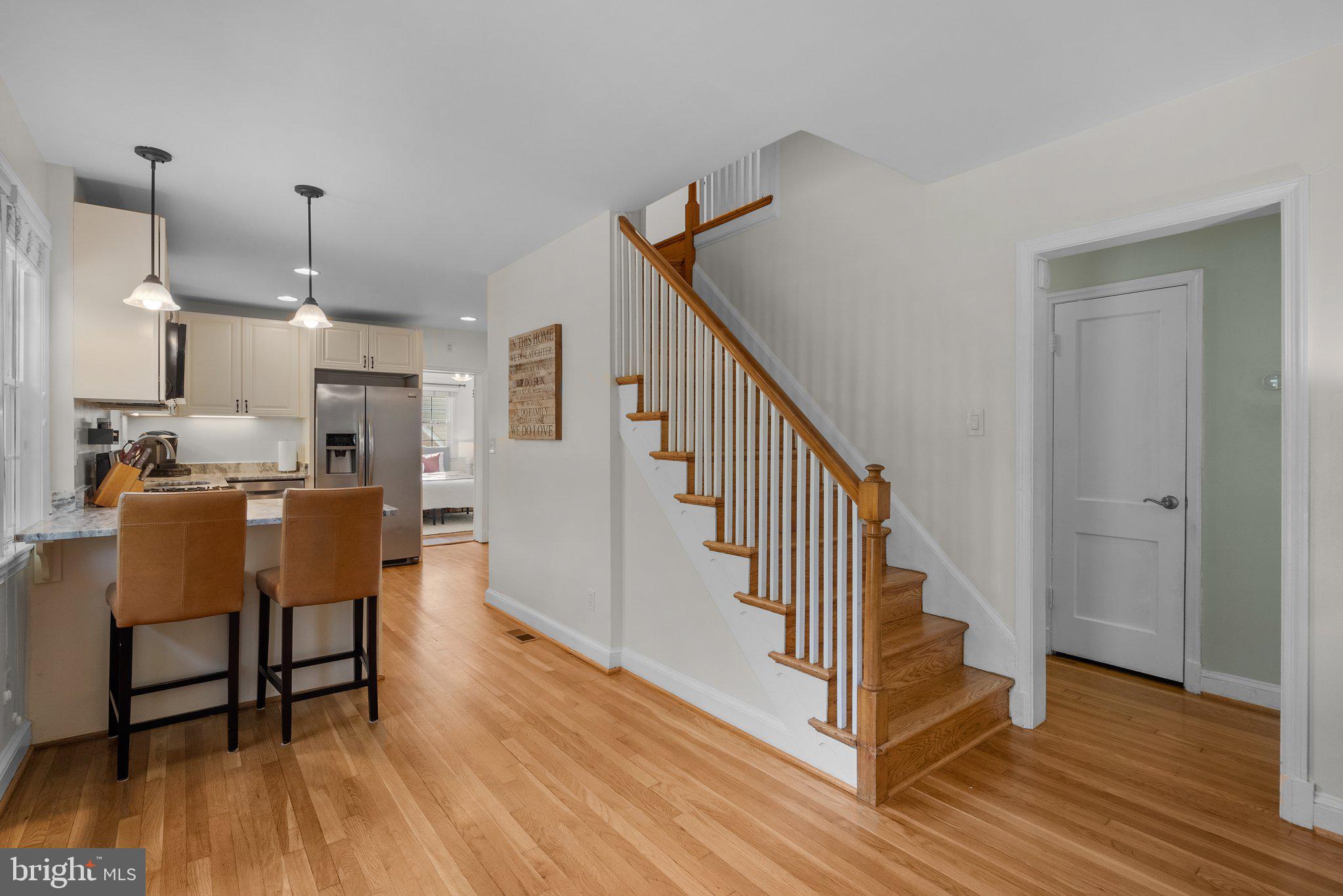 10406 Brookmoor Drive Silver Spring, MD 20901 - Photo 8 of 45 a view of a hallway with wooden floor and staircase
