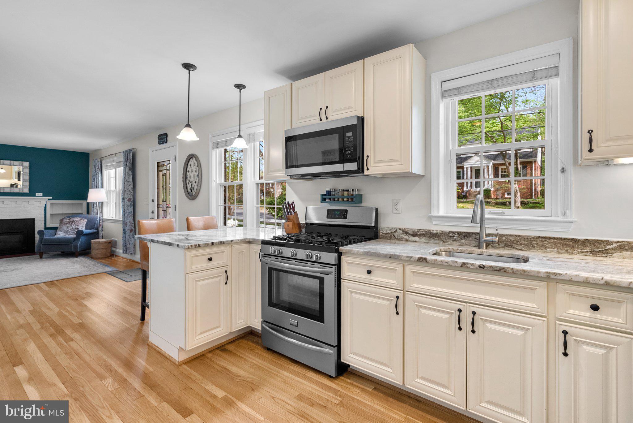 10406 Brookmoor Drive Silver Spring, MD 20901 - Photo 10 of 45 a kitchen with a sink stove and microwave