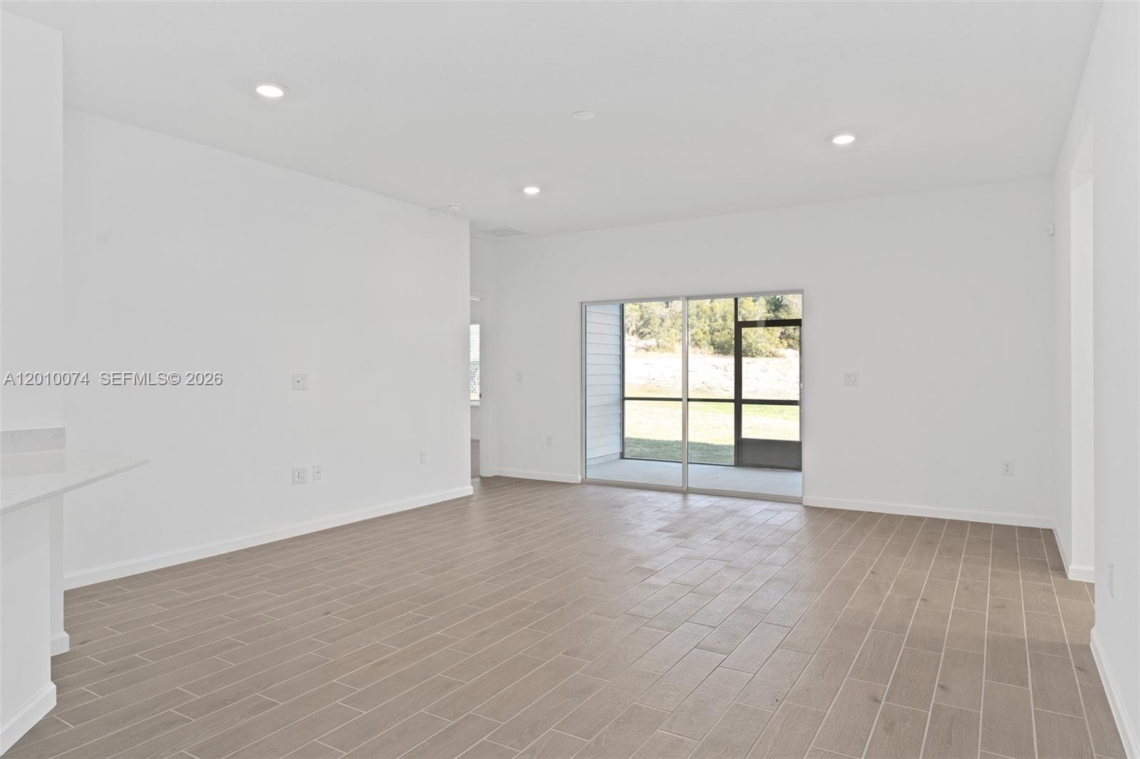 7789 Southwest 196th Terrace, Unit 1 Dunnellon, FL 34432 - Photo 20 of 36 wooden floor in an empty room with a window