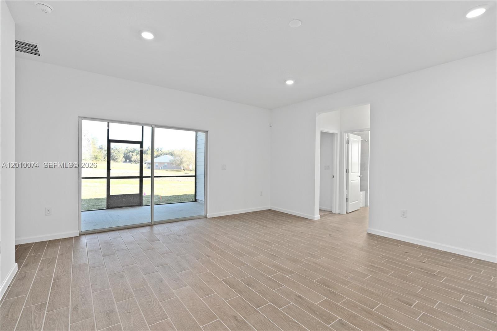 7789 Southwest 196th Terrace, Unit 1 Dunnellon, FL 34432 - Photo 22 of 36 a view of an empty room with a window