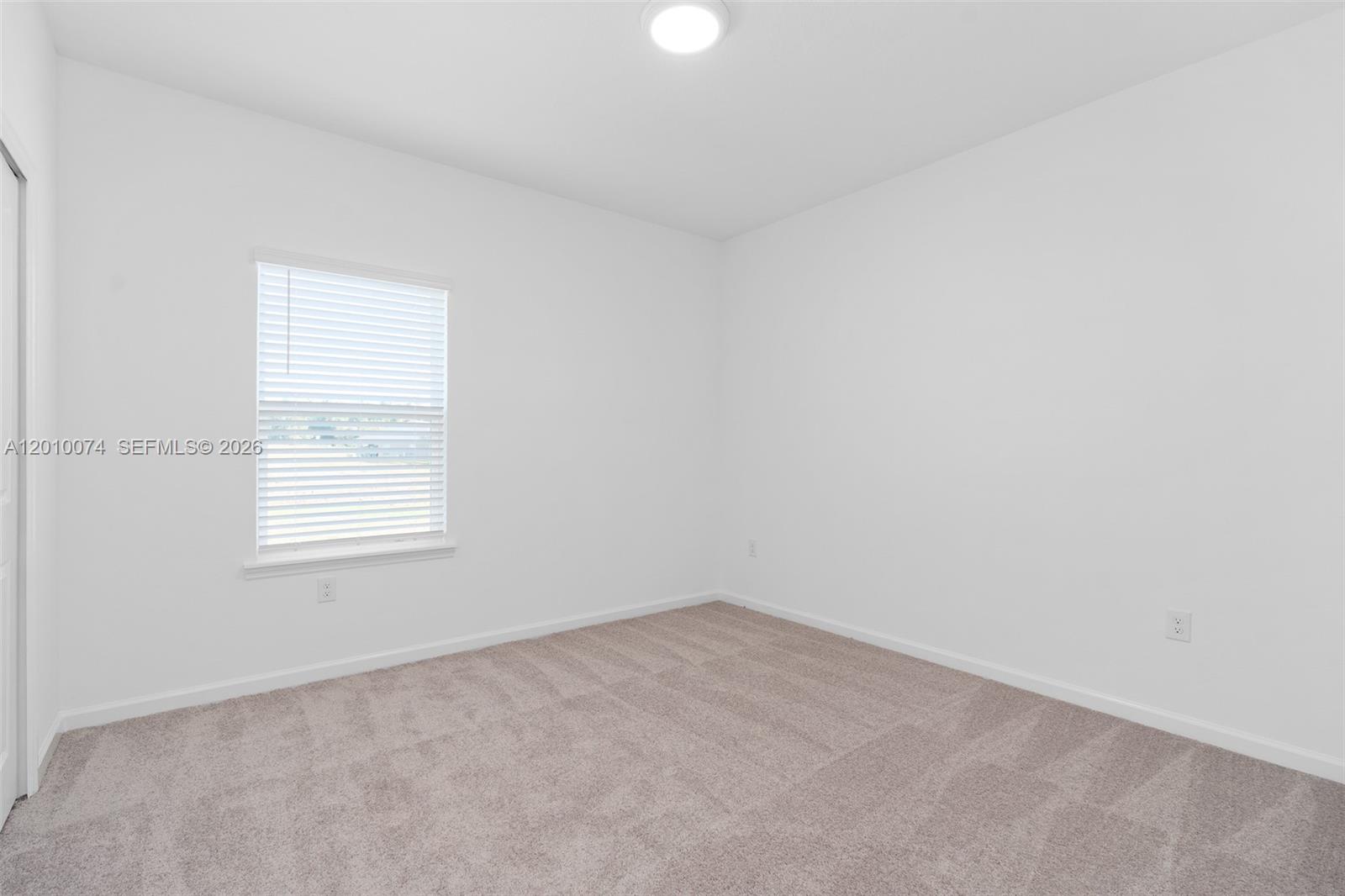 7789 Southwest 196th Terrace, Unit 1 Dunnellon, FL 34432 - Photo 24 of 36 an empty room with a window