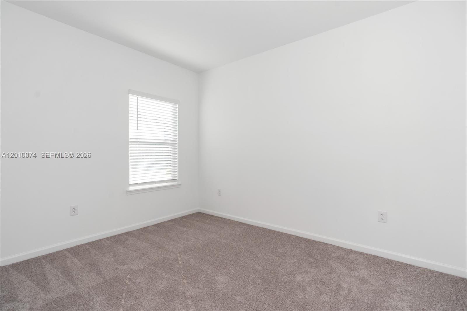7789 Southwest 196th Terrace, Unit 1 Dunnellon, FL 34432 - Photo 26 of 36 an empty room with a window