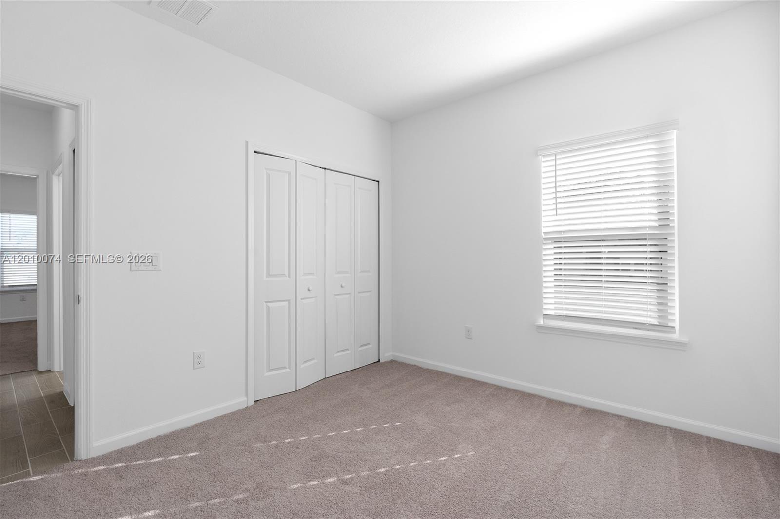 7789 Southwest 196th Terrace, Unit 1 Dunnellon, FL 34432 - Photo 27 of 36 a view of an empty room with a window