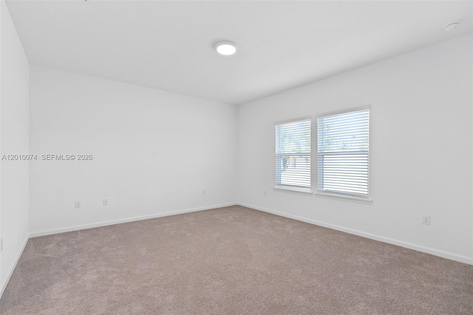 7789 Southwest 196th Terrace, Unit 1 Dunnellon, FL 34432 - Photo 28 of 36 an empty room with a window