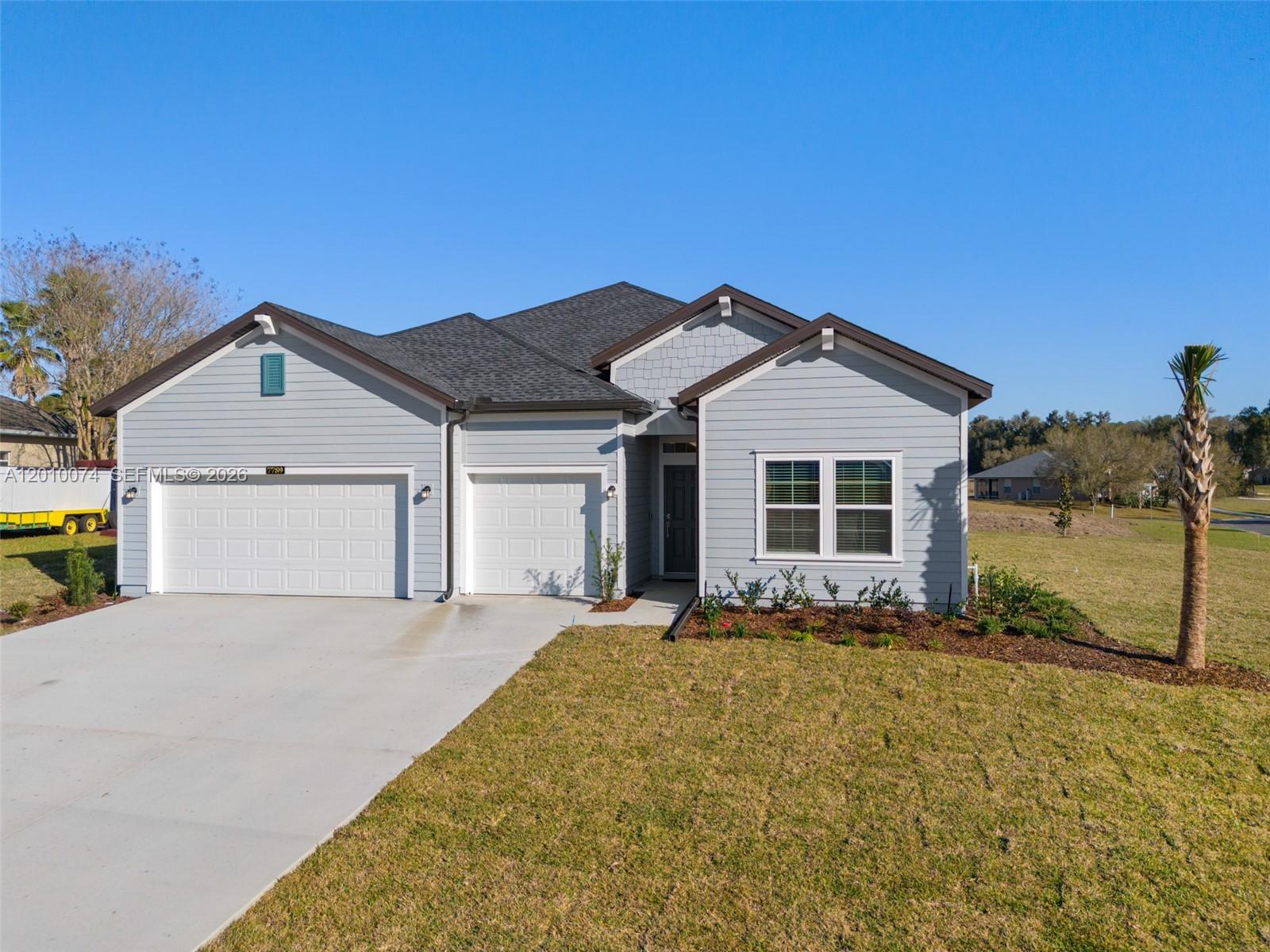 7789 Southwest 196th Terrace, Unit 1 Dunnellon, FL 34432 - Photo 3 of 36 a front view of a house with a yard