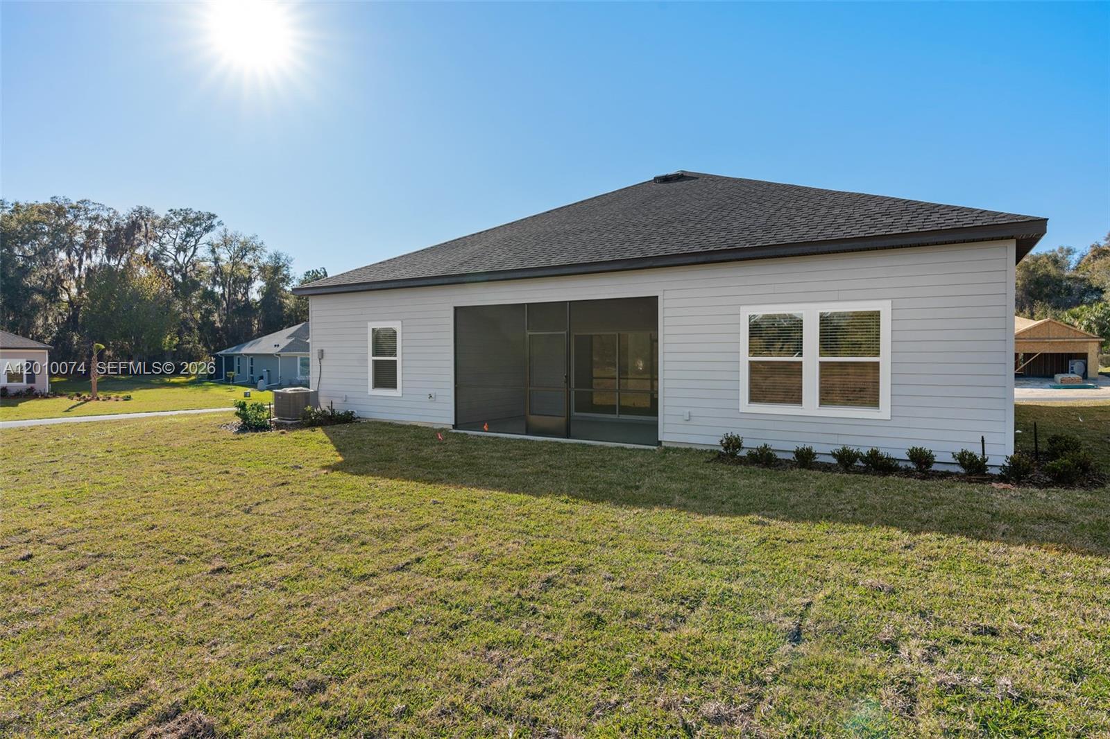 7789 Southwest 196th Terrace, Unit 1 Dunnellon, FL 34432 - Photo 34 of 36 a view of a house with a yard