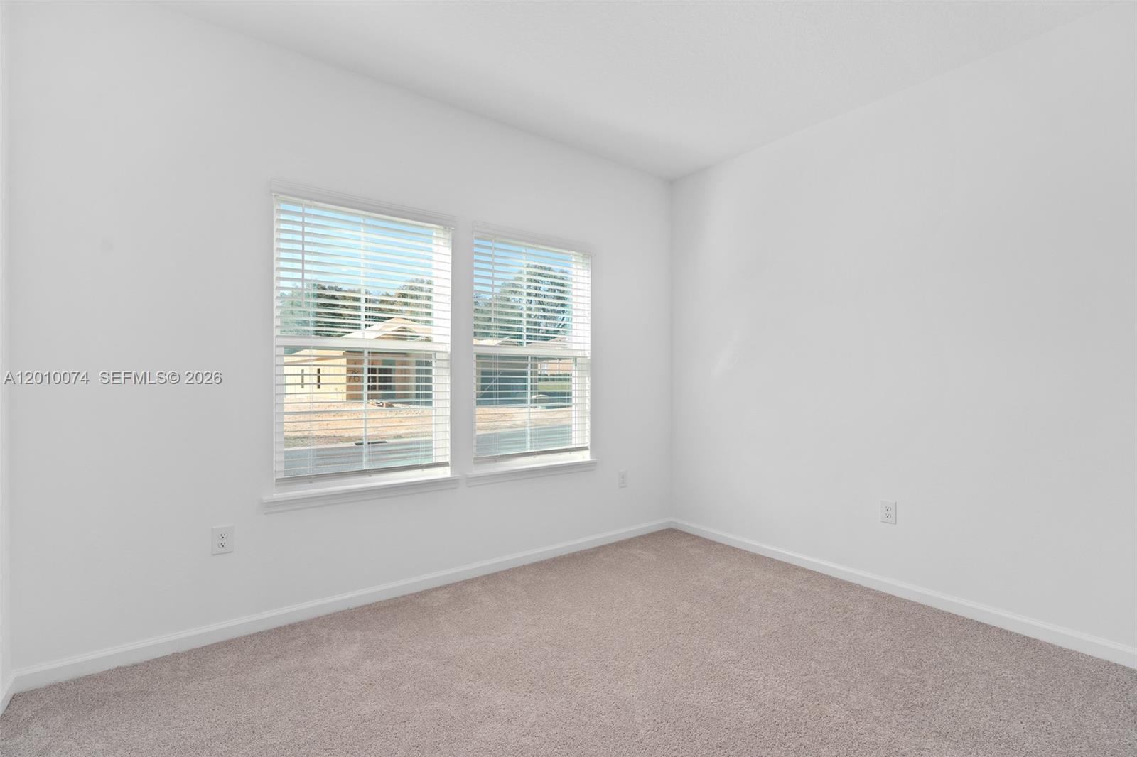 7789 Southwest 196th Terrace, Unit 1 Dunnellon, FL 34432 - Photo 9 of 36 an empty room with a window