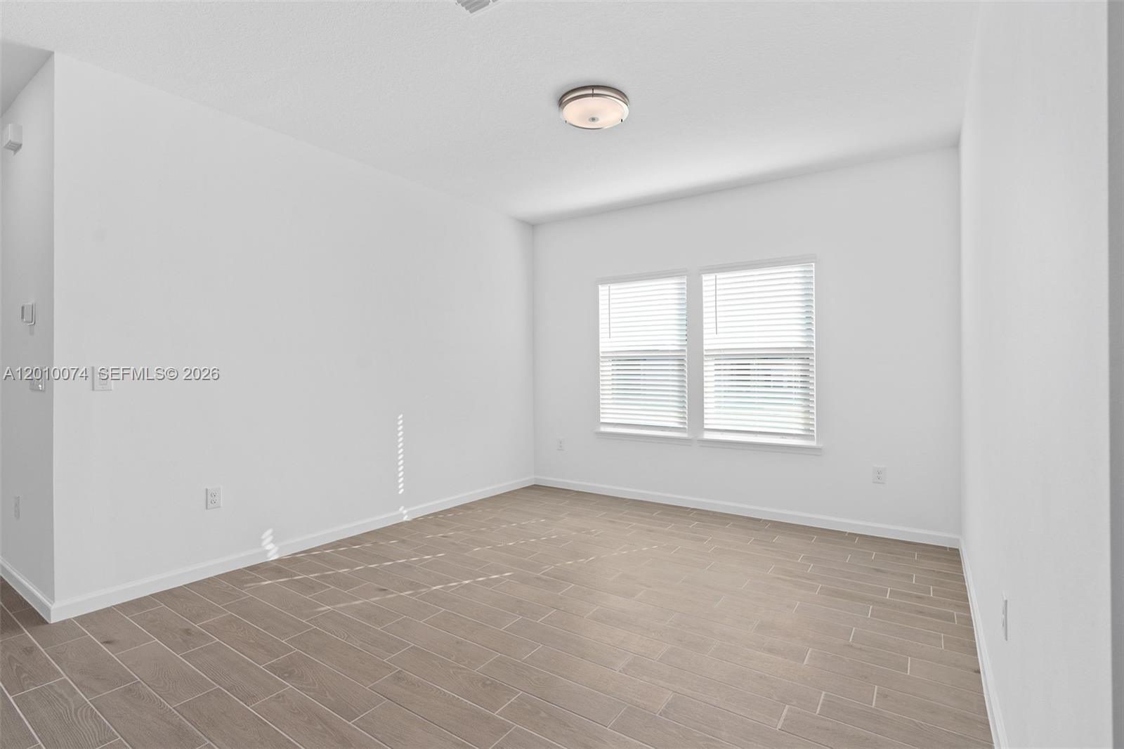 7789 Southwest 196th Terrace, Unit 1 Dunnellon, FL 34432 - Photo 10 of 36 an empty room with a window
