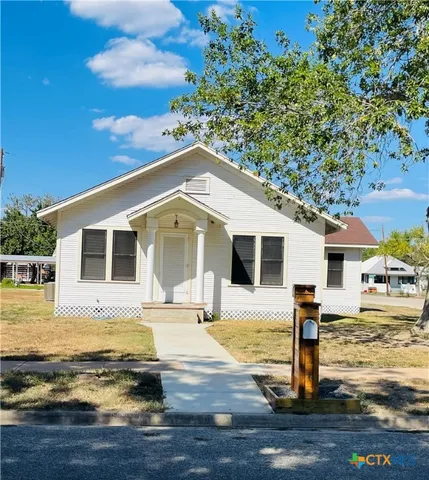 a front view of a house with swimming pool