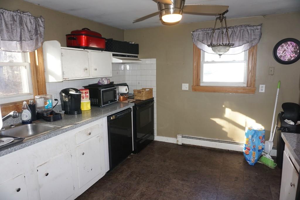 11 Payson Road Billerica, MA 01821 - Photo 4 of 14 a kitchen with granite countertop a white cabinets and window
