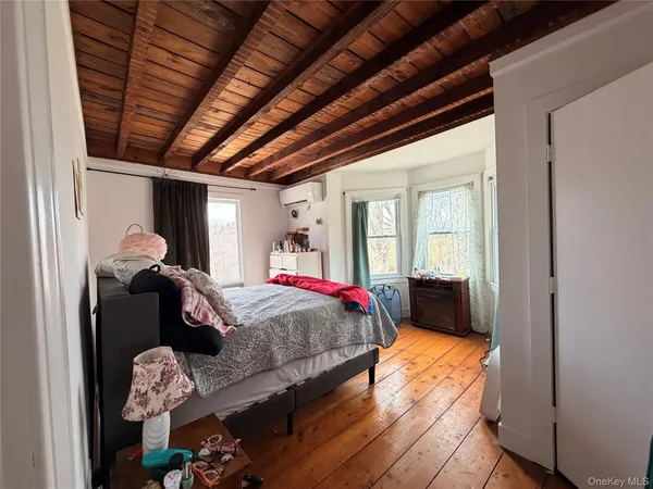 a bed room with a bed and a window