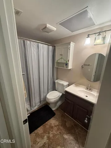 a room with a piano and wooden floor