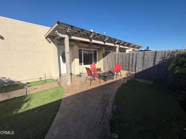 a view of a backyard with furniture