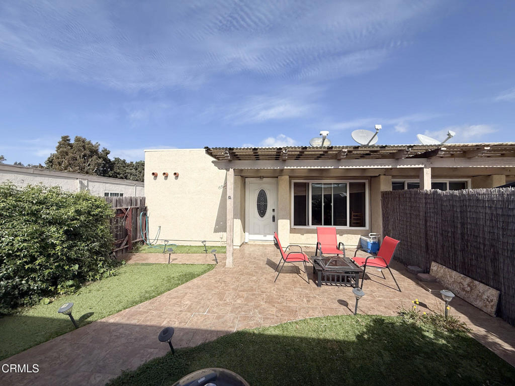 3000 Isle Way, Unit C Oxnard, CA 93035 - Photo 17 of 22 a view of a house with backyard sitting area and garden