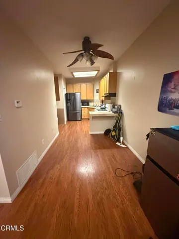 a kitchen with a stove and a refrigerator