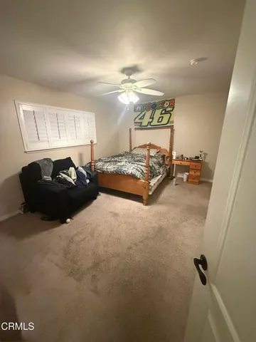 a bathroom with a toilet a sink and a mirror