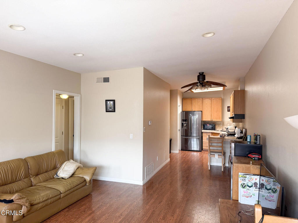 3000 Isle Way, Unit C Oxnard, CA 93035 - Photo 10 of 22 a living room with furniture and wooden floor