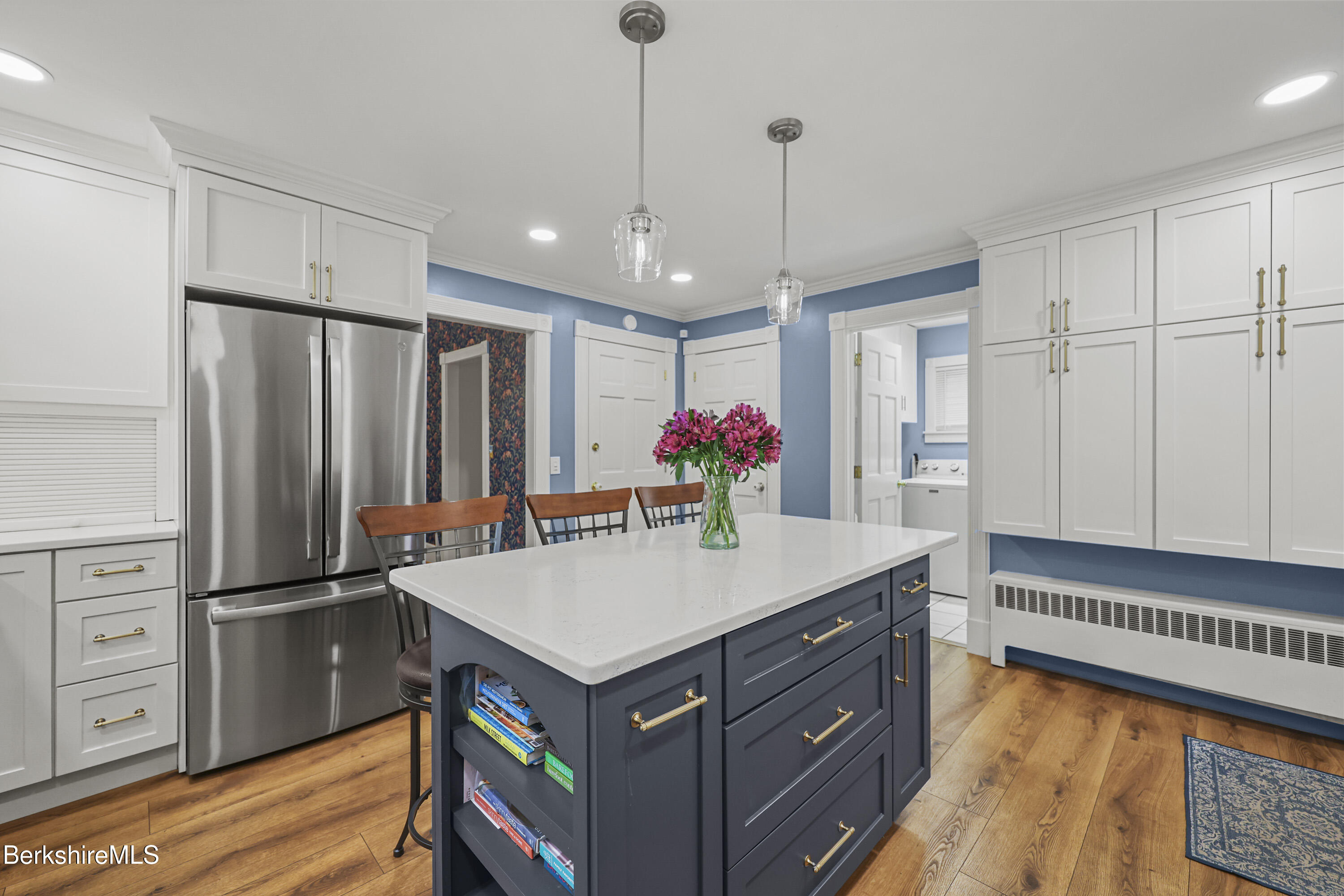 67 Cherry Street North Adams, MA 01247 - Photo 19 of 59 a kitchen with kitchen island white cabinets and stainless steel appliances