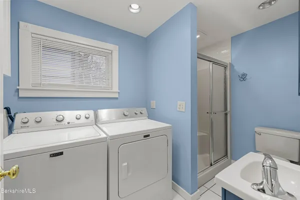 a view of hallway with wooden floor