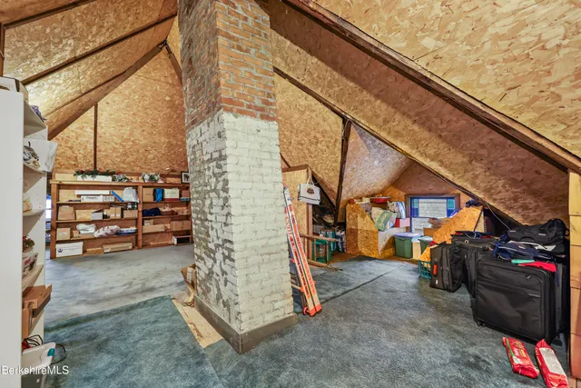 a view of a livingroom with furniture and a flat screen tv