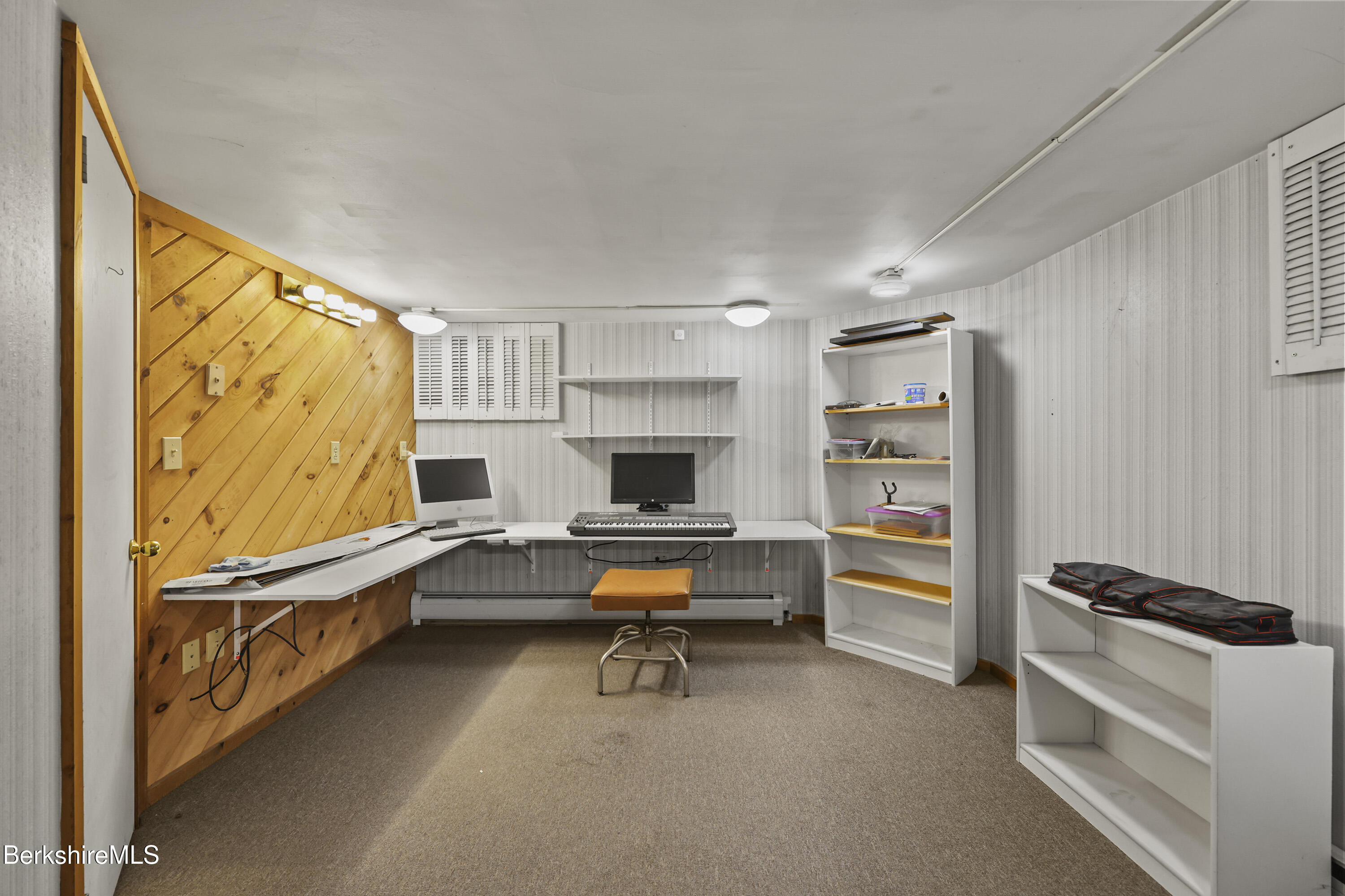 67 Cherry Street North Adams, MA 01247 - Photo 43 of 59 a view of a livingroom with furniture and a flat screen tv