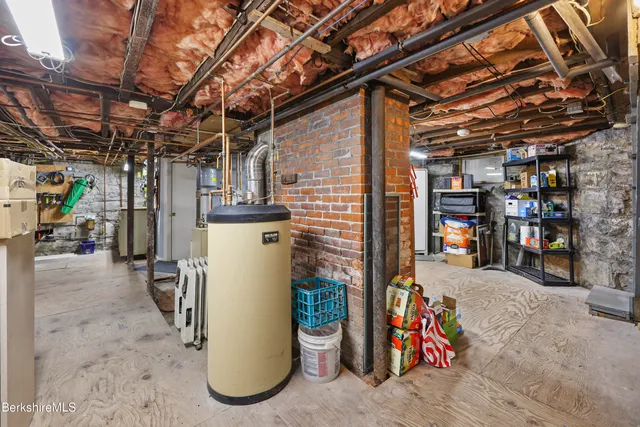a view of a chairs and table in the back yard of the house