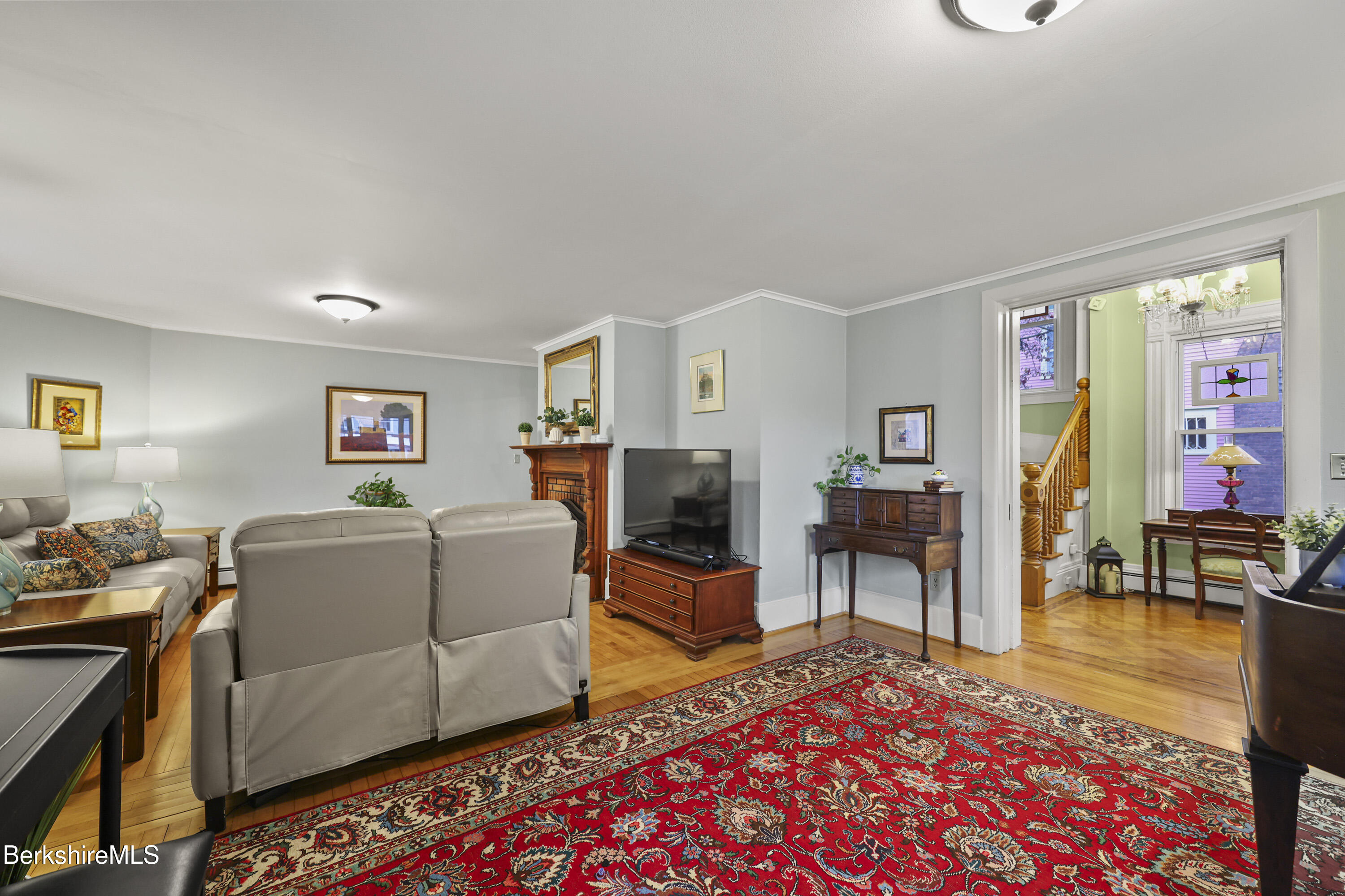 67 Cherry Street North Adams, MA 01247 - Photo 6 of 59 a living room with furniture and a flat screen tv