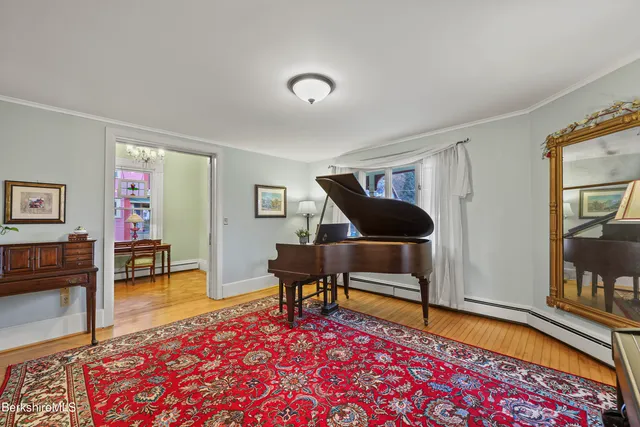a living room with furniture and a rug