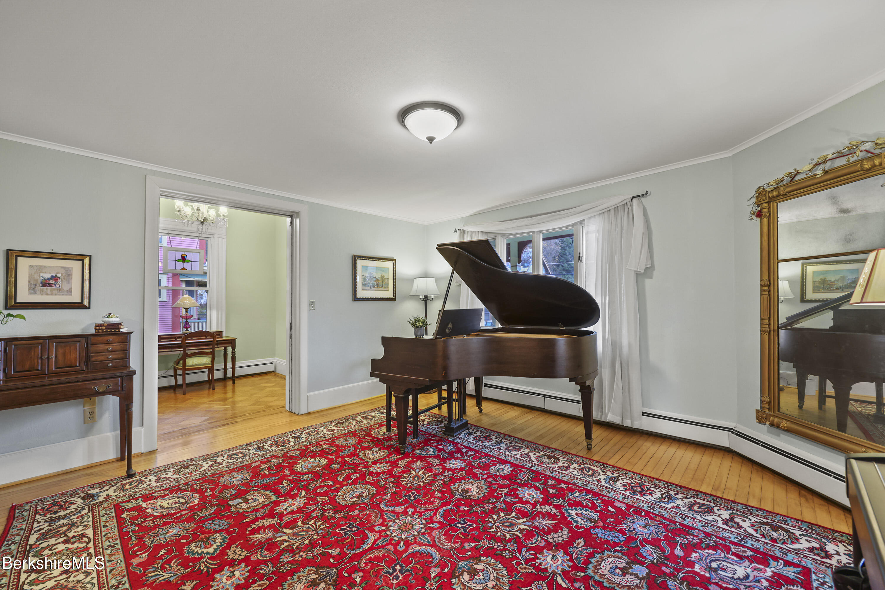 67 Cherry Street North Adams, MA 01247 - Photo 7 of 59 a living room with furniture and a wooden floor