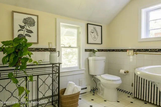 a bathroom with a shower sink and mirror