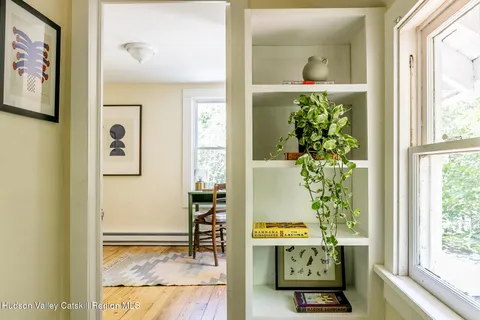 a view of a livingroom with furniture and a window
