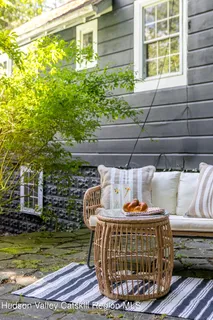 a front view of a house with a garden
