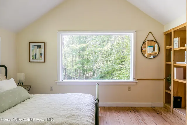 a view of a bathroom with a sink and a mirror