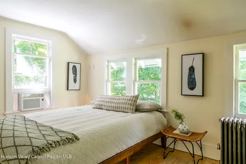 a bathroom with a toilet a sink and a window