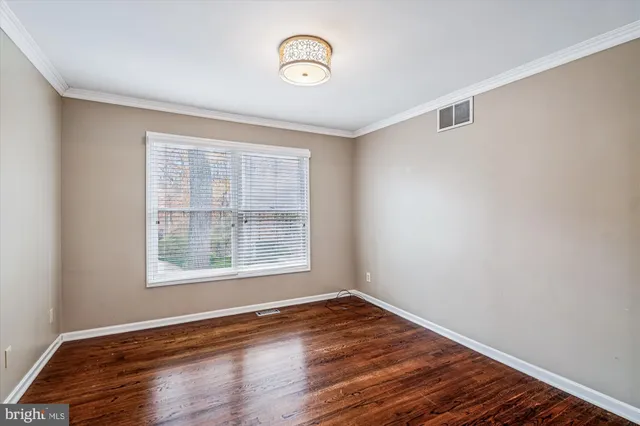 a view of livingroom with hardwood floor and workspace