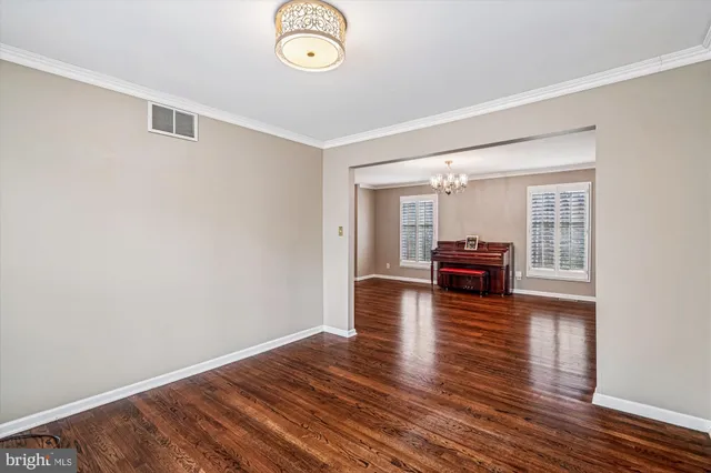 a kitchen with stainless steel appliances granite countertop a refrigerator a sink a stove and a refrigerator