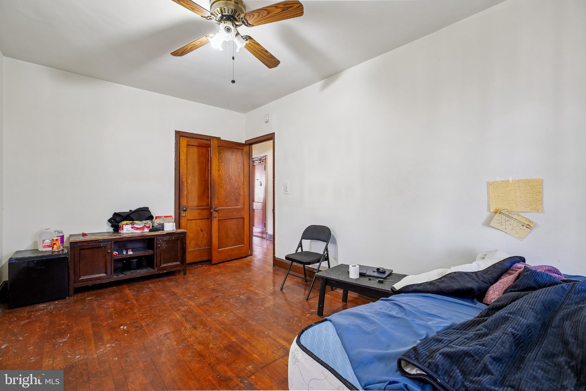 5618 1st Street Northwest Washington, DC 20011 - Photo 9 of 18 a bedroom with a bed and a chandelier