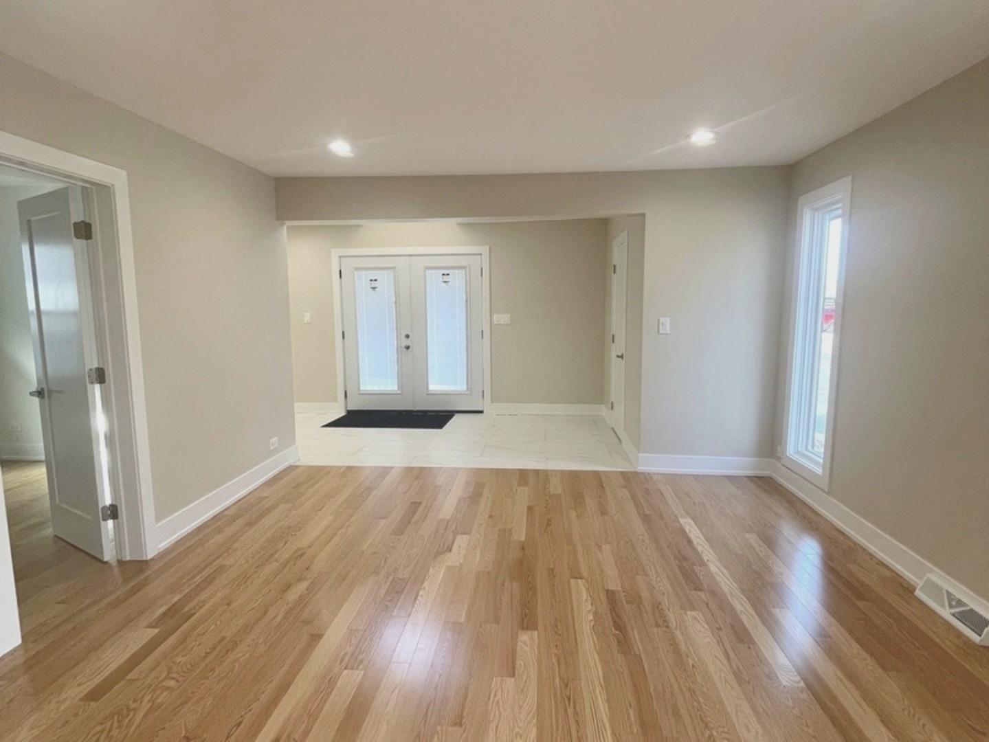 26073 West Grand Avenue Ingleside, IL 60041 - Photo 11 of 36 wooden floor in an empty room with a window