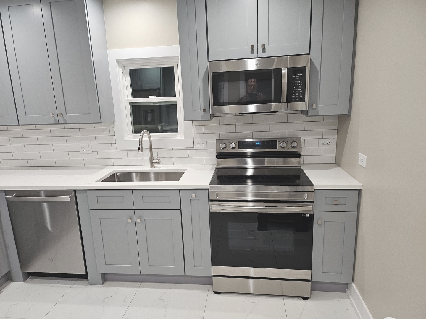 26073 West Grand Avenue Ingleside, IL 60041 - Photo 19 of 36 a kitchen with a stove and a microwave