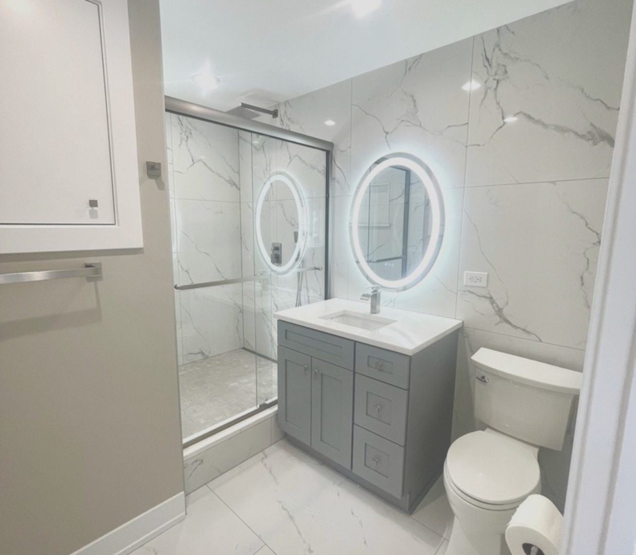 26073 West Grand Avenue Ingleside, IL 60041 - Photo 24 of 36 a bathroom with a sink a toilet and a mirror