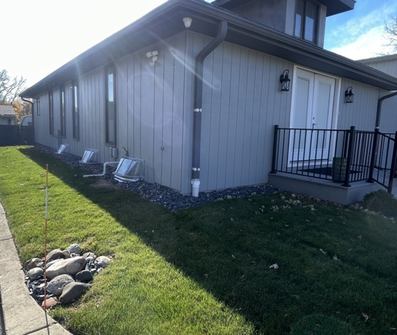 26073 West Grand Avenue Ingleside, IL 60041 - Photo 4 of 36 a view of backyard with potted plants and wooden fence