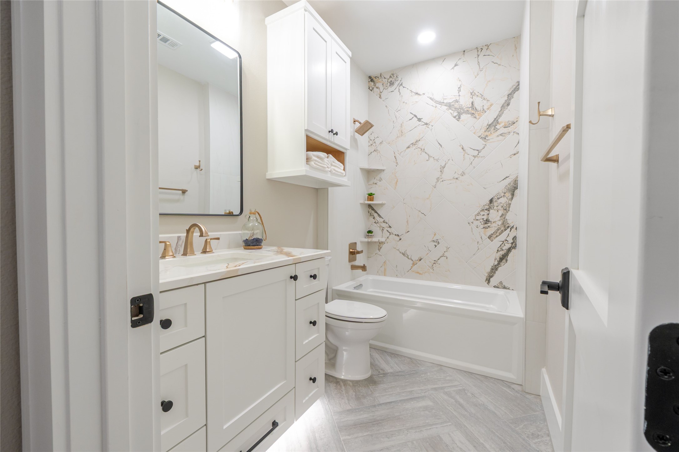 3100 Garwood Street Austin, TX 78702 - Photo 21 of 25 Full bath featuring vanity, shower / bathtub combination, recessed lighting, and parquet floors