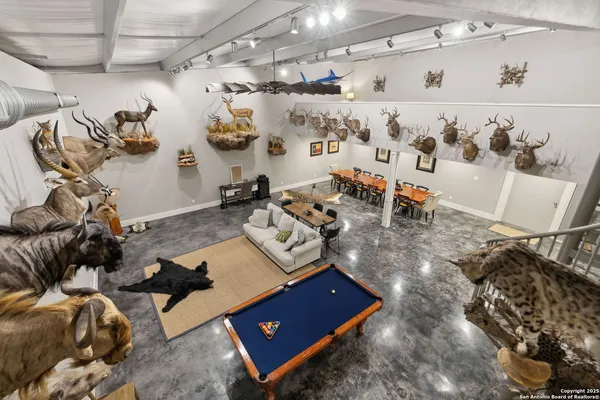 a living room with lots of furniture and decor
