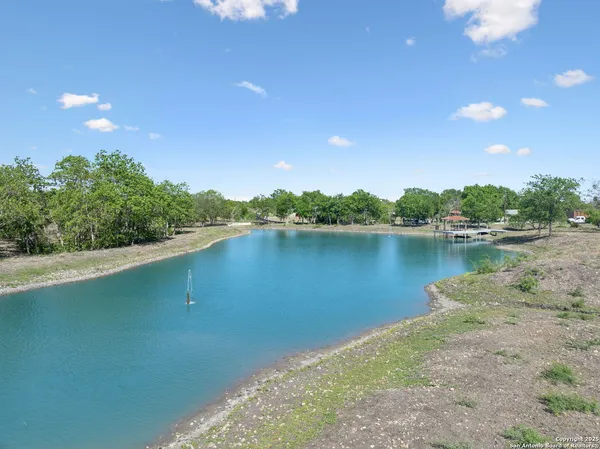 a view of a lake with a yard