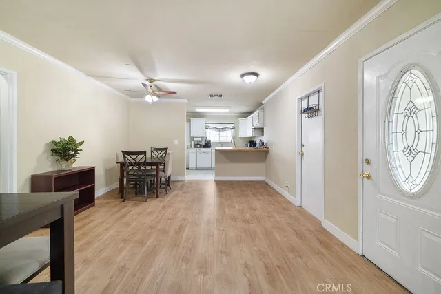 a view of a livingroom with furniture and a kitchen