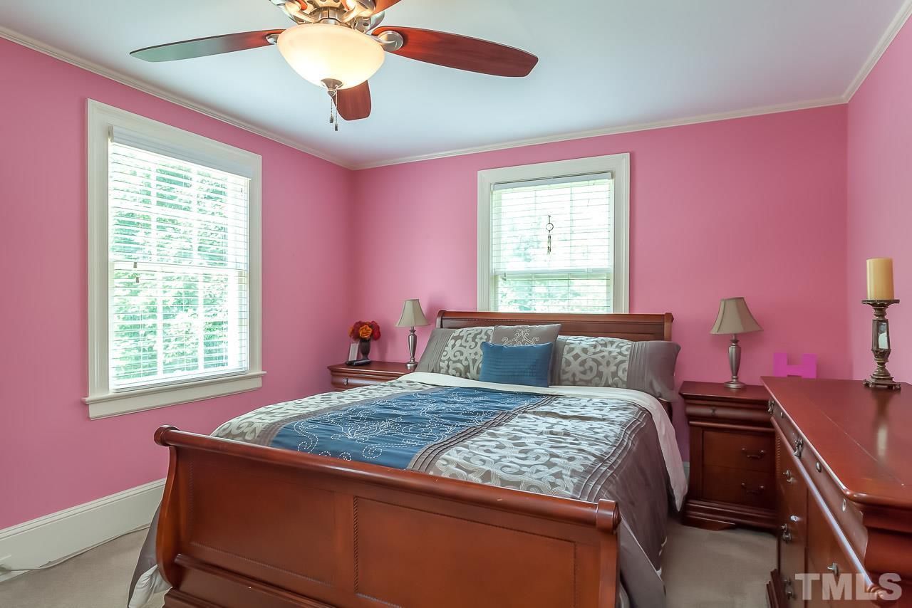 2518 Beechridge Road Raleigh, NC 27608 - Photo 14 of 25 a bedroom with a bed and a window