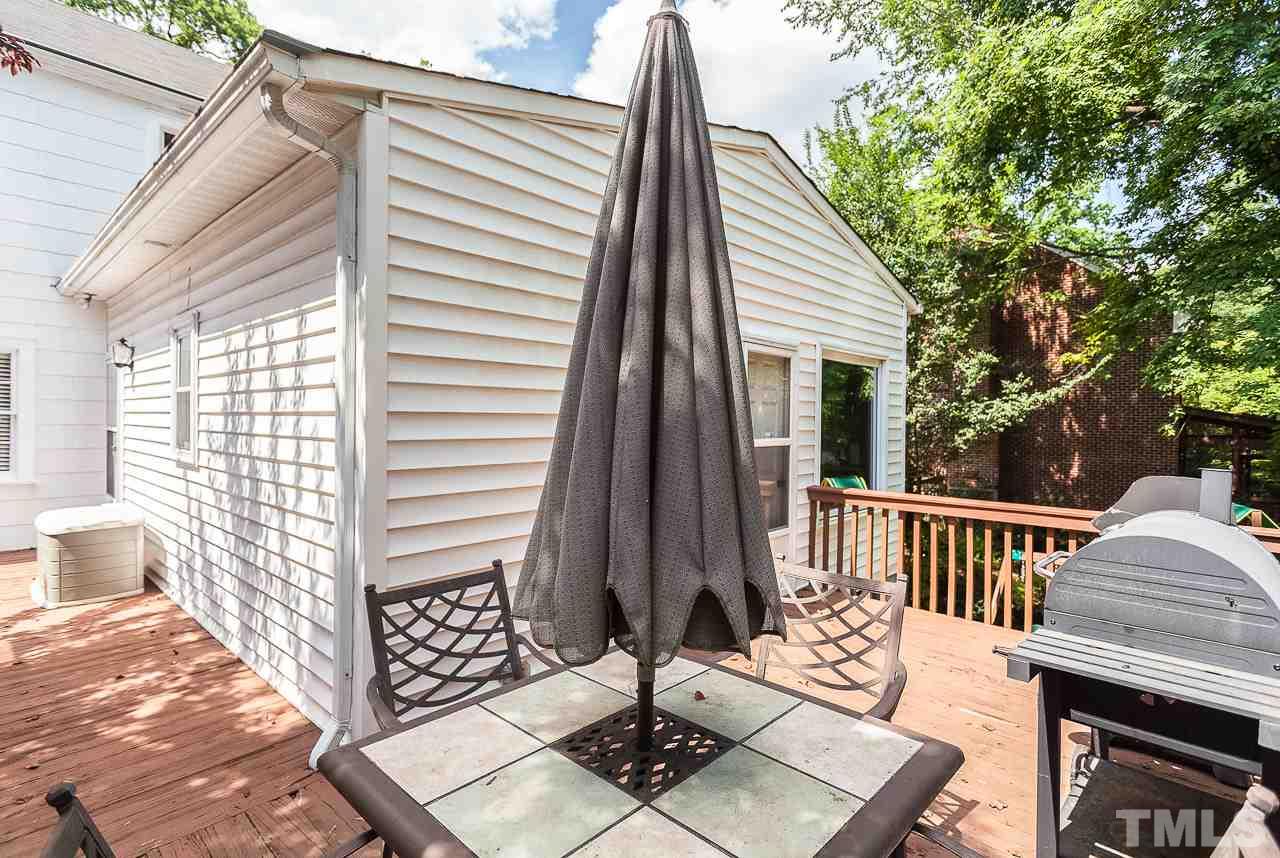 2518 Beechridge Road Raleigh, NC 27608 - Photo 19 of 25 a view of a patio with a table and chairs